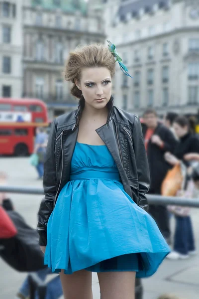 Attrractive woman in blue dress posing front camera — Stock Photo, Image