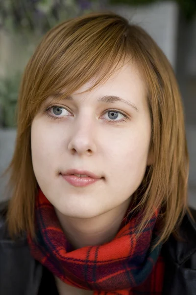 Closeup portrait of young serious attractive woman with blue eye — Stock Photo, Image