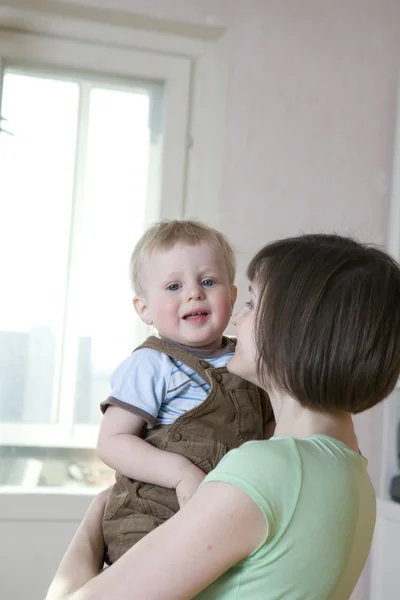 Young happy beautiful mother kiss  her little baby — Stock Photo, Image