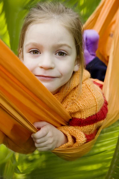 Girl in yellow hammock — Stock Photo, Image