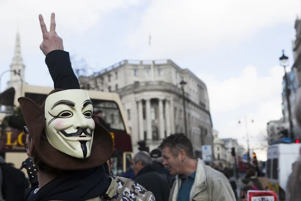 London, uk - 1. märz 2014. londoner demonstranten marschieren gegen die weltweite korruption der regierung. in London am 1. März 2014. — Stockbild Londoner Demonstranten demonstrieren gegen weltweite Regierungskorruption — Stockfoto