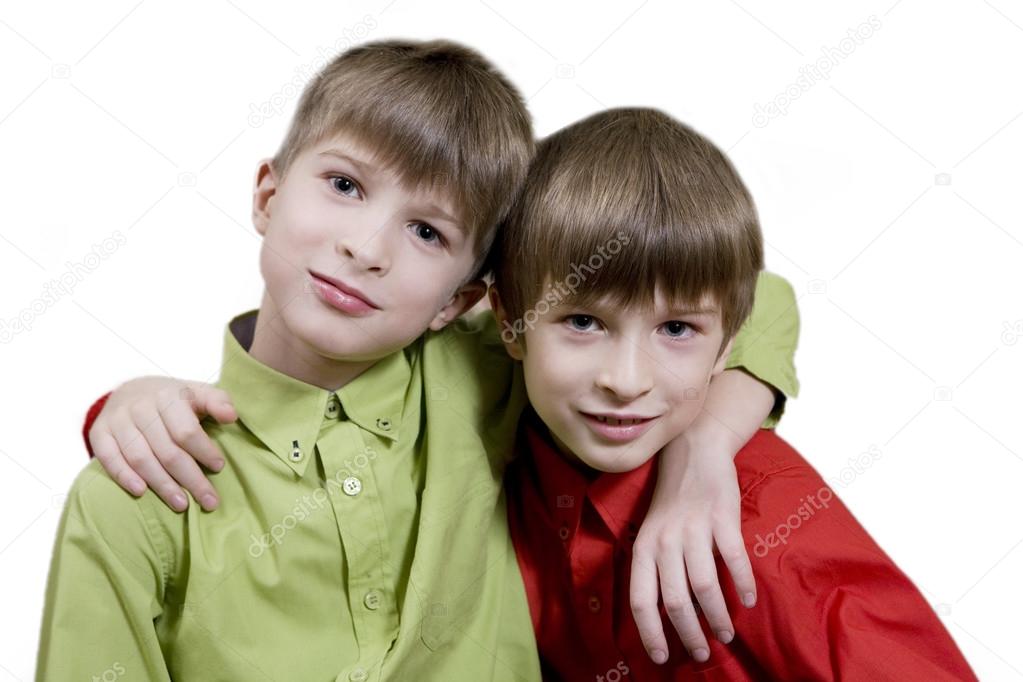 Portrait of twins brothers sitting together