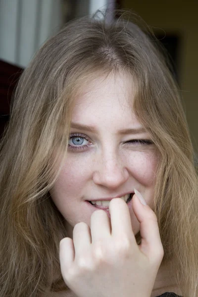 Cheeky blond teenager looking at the camera — Stock Photo, Image