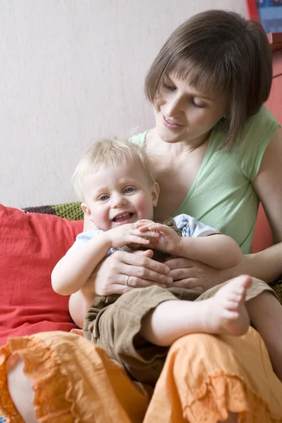 Young happy beautiful mother kiss  her little baby — Stock Photo, Image