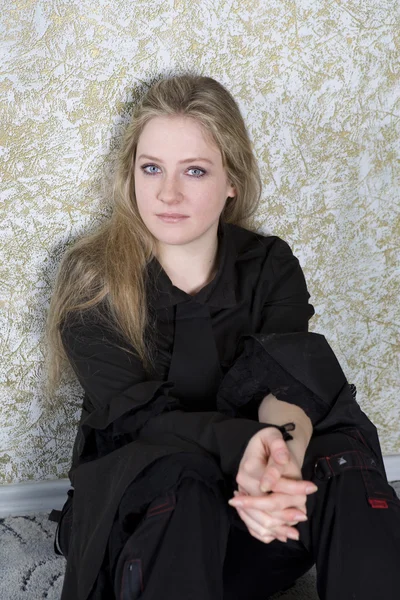 Crying teen girl wearing Gothic clothes sitting on the floor — Stock Photo, Image