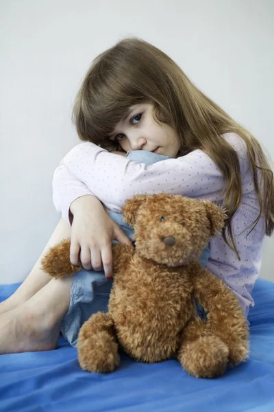 Little girl with toy bear — Stock Photo, Image