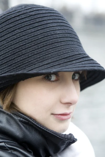 Portrait of serious woman wearing hat — Stock Photo, Image