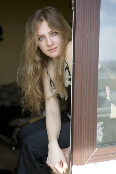 Cheeky blond teenager looking at the camera — Stock Photo, Image