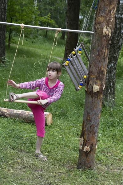 Girl in swing. — Stock Photo, Image