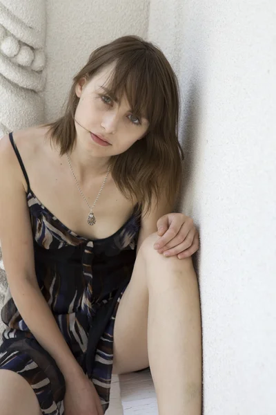 Sensual portrait of young beautiful brunette with tattoo standing at old window — Stock Photo, Image