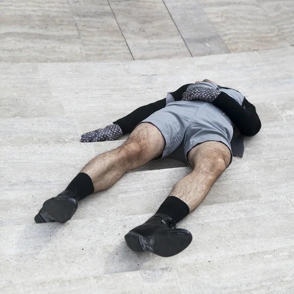 Man laying on a staircase — Stock Photo, Image