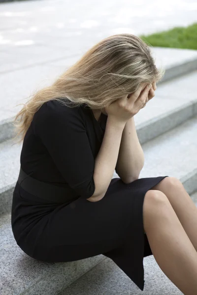 Depressed teen girl sitting on stairs — Stock Photo, Image