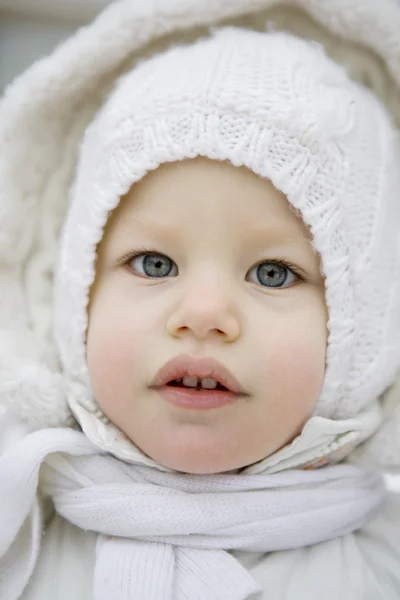 Portrait of little girl in hood — Stock Photo, Image