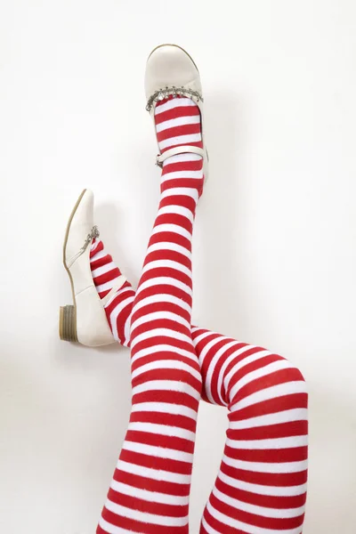 Woman legs wearing stripes socks — Stock Photo, Image