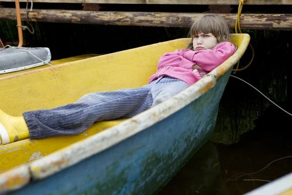 Children playing in yellow boat — Stock Photo, Image