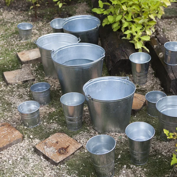Zinc bucket of water standing — Stock Photo, Image