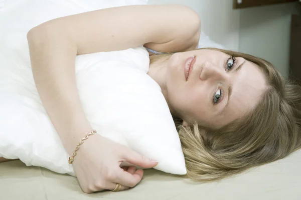 Sad woman in bed — Stock Photo, Image