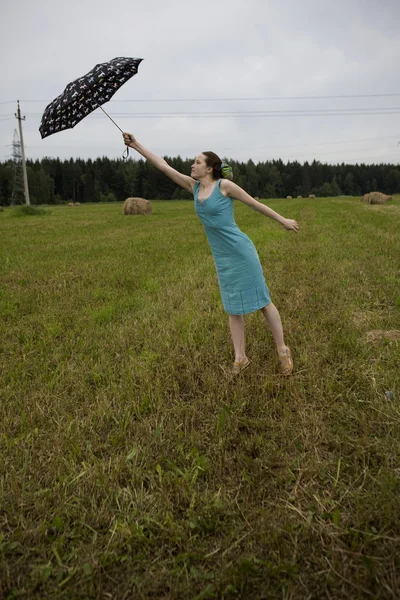 Flying woman with umbrella — Stock Photo, Image