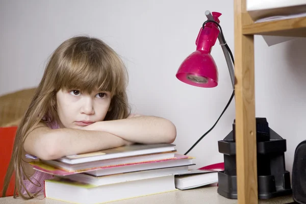 Unhappy little girl studying — Stock Photo, Image