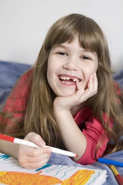 Little cute smiling girl seven years old with drawing picture — Stock Photo, Image
