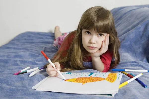 Laughing girl with drawing picture — Stock Photo, Image