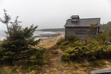 Kola Peninsula, Russia, November, 2021. Russian scene; Tersky coast of the White sea. Historical and Ethnographic Complex Tony Tetrina is a atmospheric location. The reconstructed village of Pomors. clipart