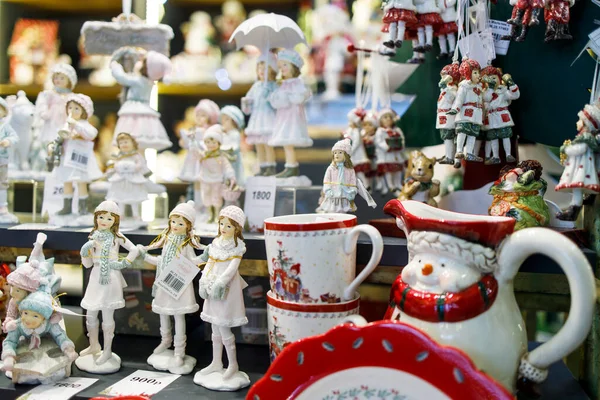 Moscow, Russia - 20 December 2021 festivities on the Manezhnaya Square in Moscow. festival Christmas trip. Ceramic Christmas toys: girls, princesses, squirrels, mugs and figurines for sale at the fair