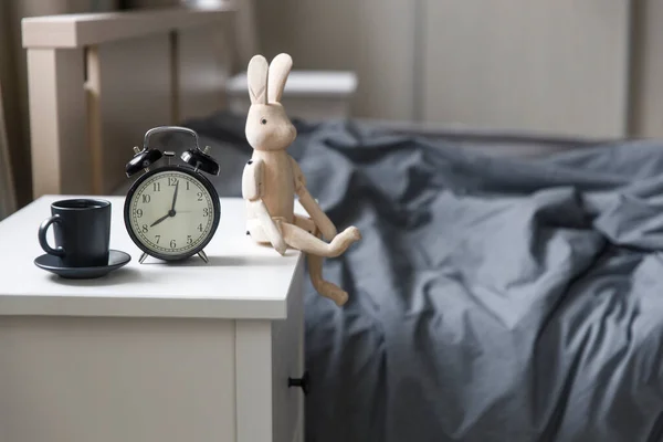 Image Alarm Clock Black Cup Coffee Figurine Wooden Hare White — Stock Photo, Image