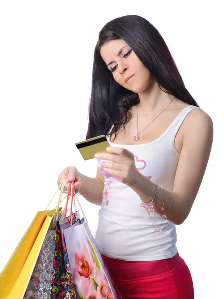 The beautiful girl with a credit card and bags — Stock Photo, Image