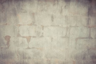 Taş duvar ve gri beton zemin zemin.