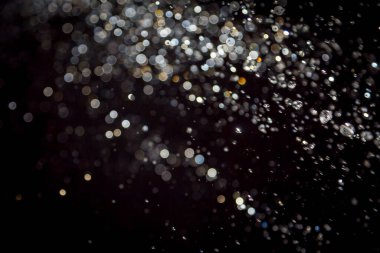 siyah arka plan üzerinde renkli bokeh