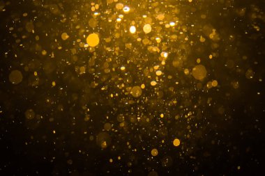 Siyah arkaplan ile soyut altın bokeh