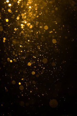 Siyah arkaplan ile soyut altın bokeh