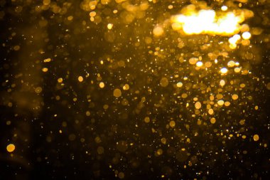 Siyah arkaplan ile soyut altın bokeh