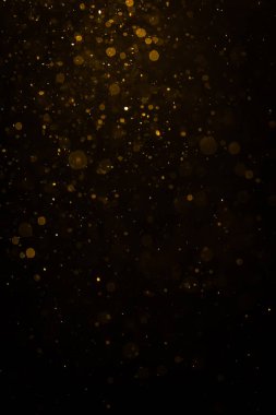 Siyah arkaplan ile soyut altın bokeh