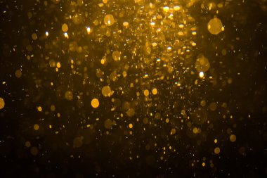 Siyah arkaplan ile soyut altın bokeh