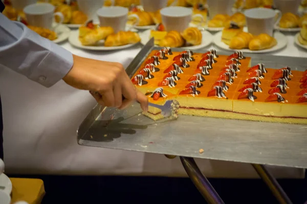 Row of croissants, cakes and a cup of coffee snacks for seminars