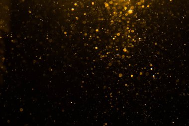 Siyah arkaplan ile soyut altın bokeh