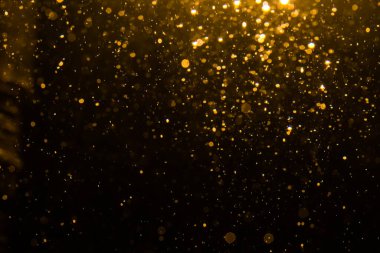 Siyah arkaplan ile soyut altın bokeh