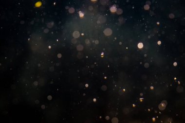 Siyah arka plan üzerinde ışık bokeh bulanıklık