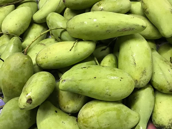 Green mango in the market background