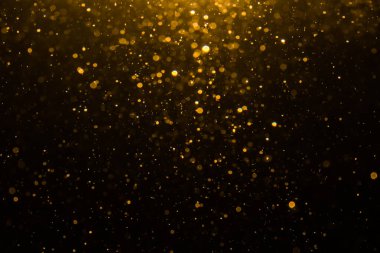 Siyah arkaplan ile soyut altın bokeh