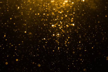 Siyah arkaplan ile soyut altın bokeh