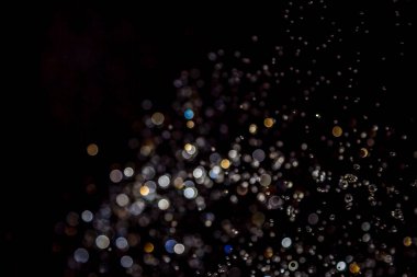 siyah arka plan üzerinde renkli bokeh