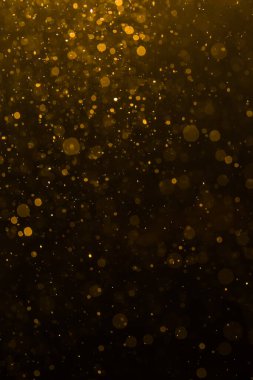 Siyah arkaplan ile soyut altın bokeh