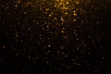 Siyah arkaplan ile soyut altın bokeh