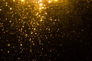 Siyah arkaplan ile soyut altın bokeh