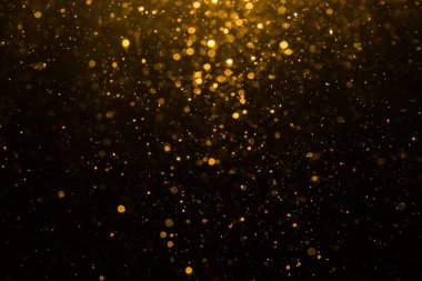 Siyah arkaplan ile soyut altın bokeh