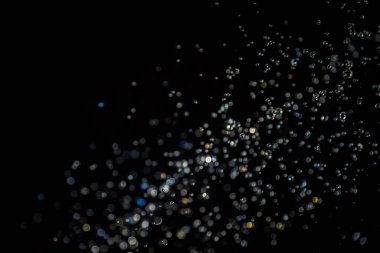 siyah arka plan üzerinde renkli bokeh