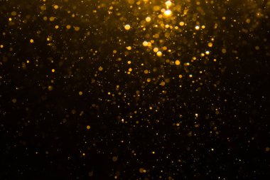 Siyah arkaplan ile soyut altın bokeh